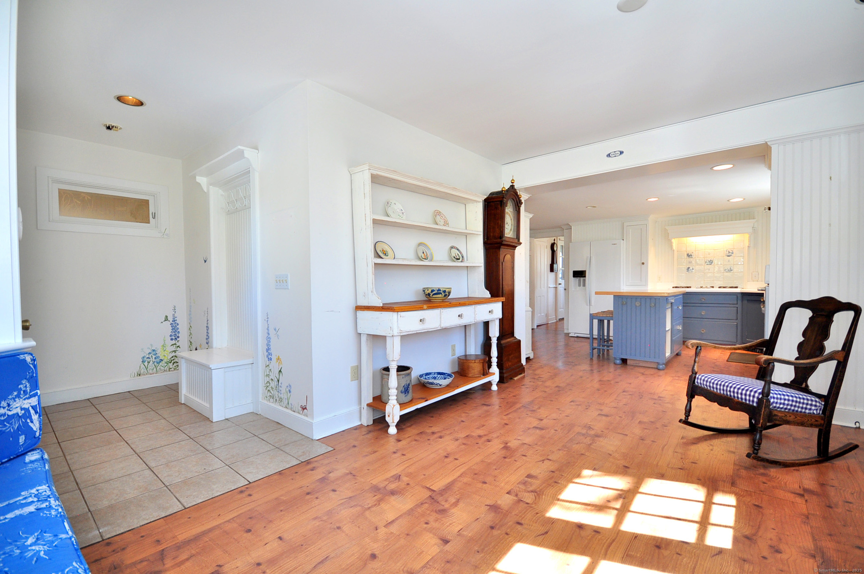 72 Clapboard Road Bridgewater, CT 06752 - Photo 11 of 39 a living room with furniture and a dining table with rug kitchen view