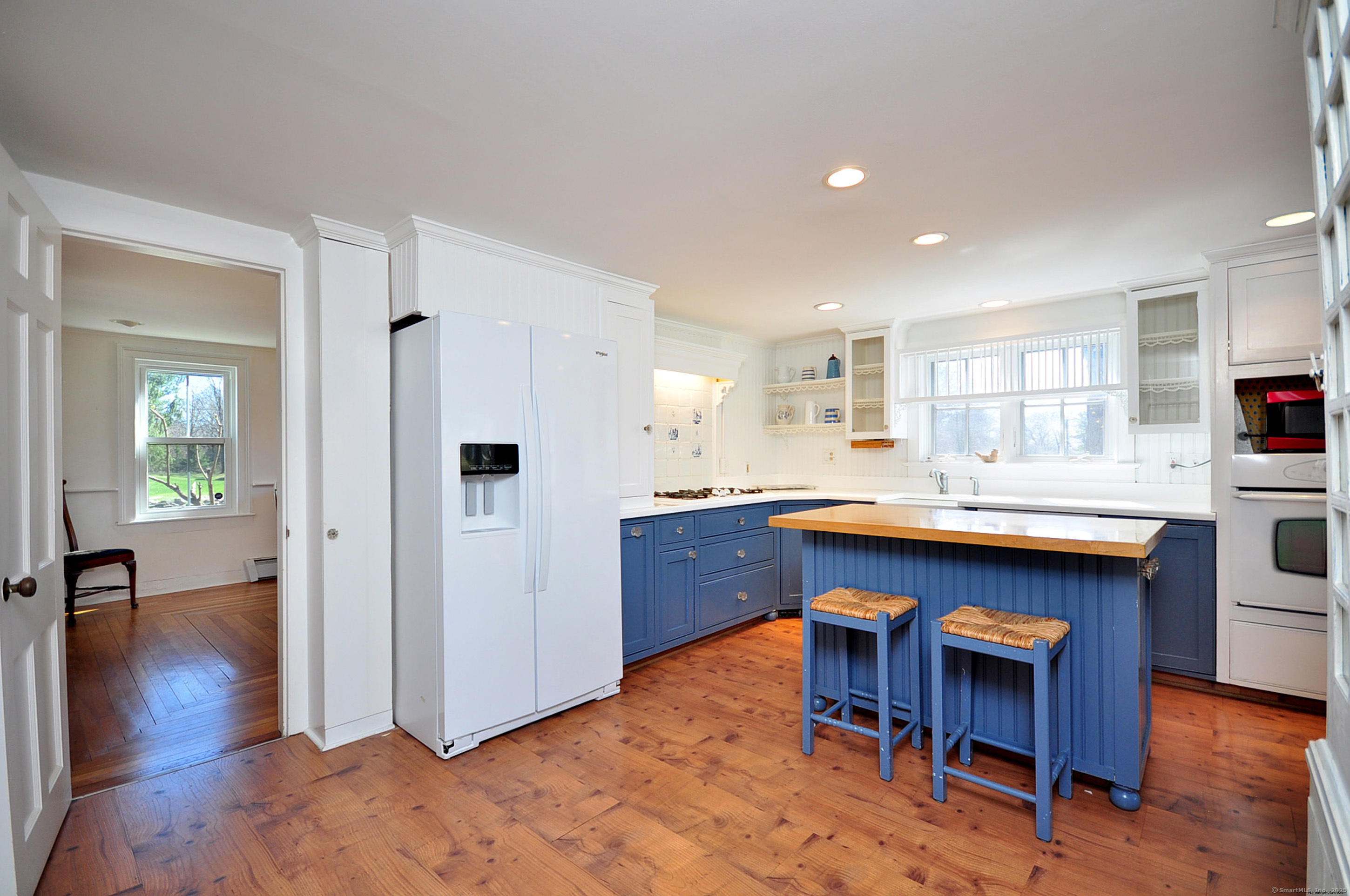 72 Clapboard Road Bridgewater, CT 06752 - Photo 17 of 39 a kitchen with kitchen island wooden cabinets and center island
