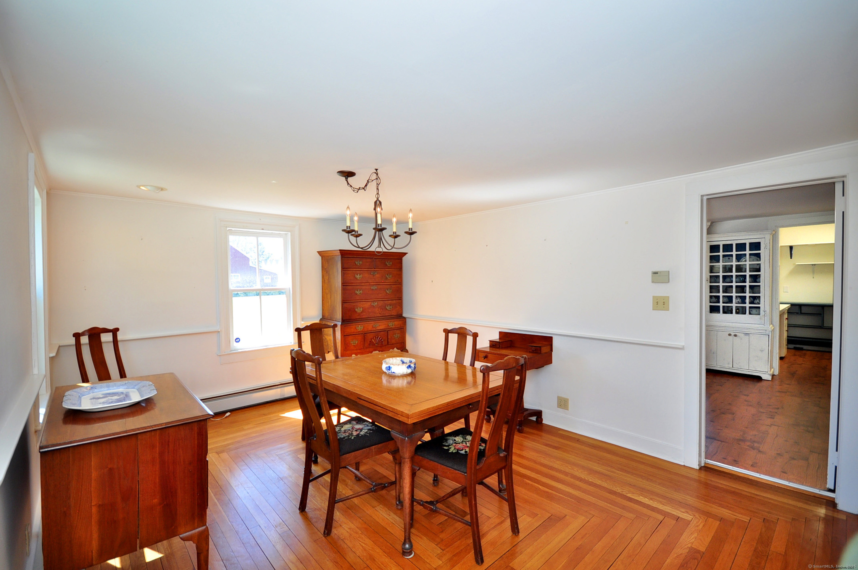 72 Clapboard Road Bridgewater, CT 06752 - Photo 19 of 39 a view of a dining room with furniture and wooden floor