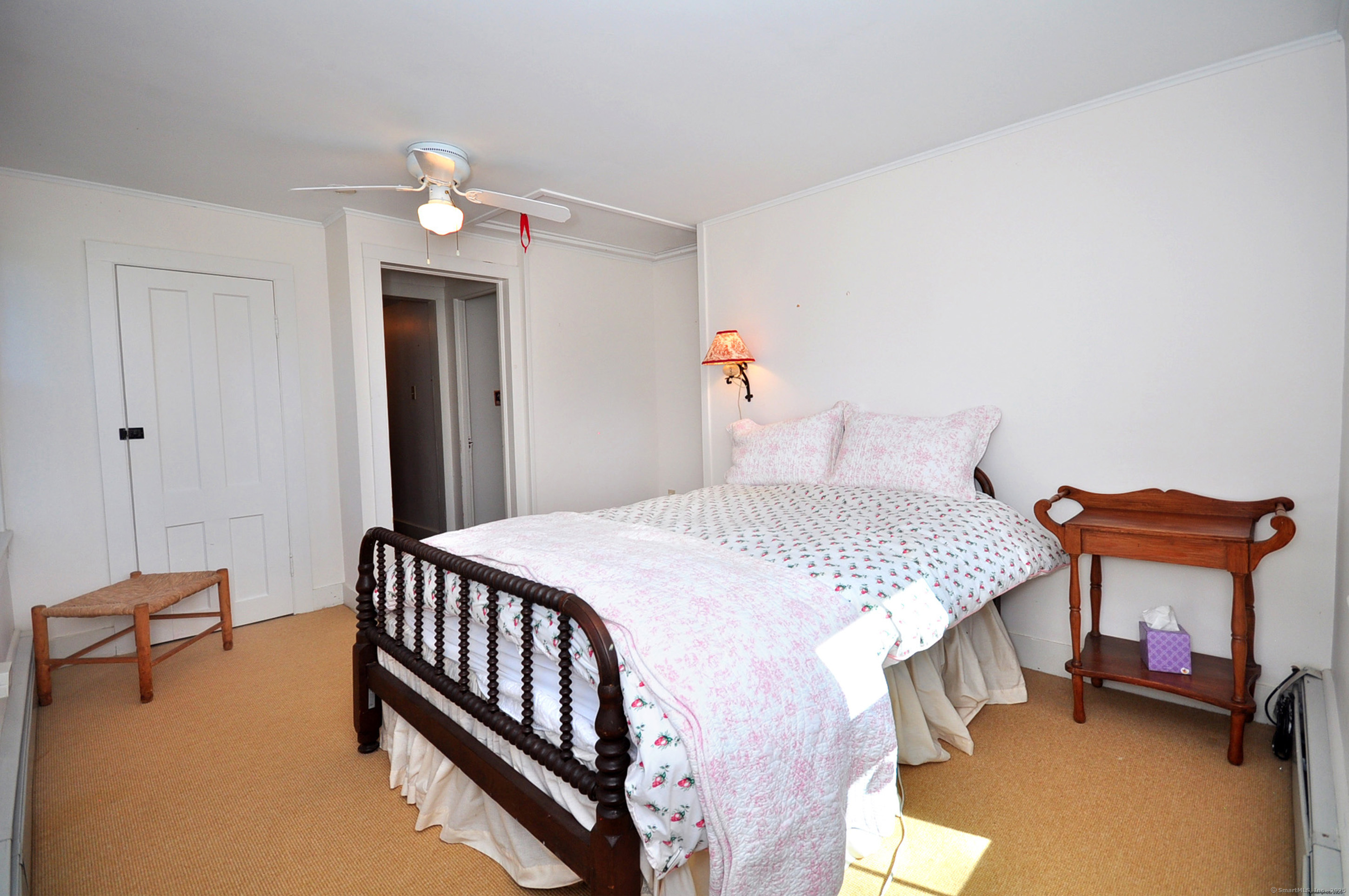 72 Clapboard Road Bridgewater, CT 06752 - Photo 33 of 39 a bedroom with a bed and a chandelier