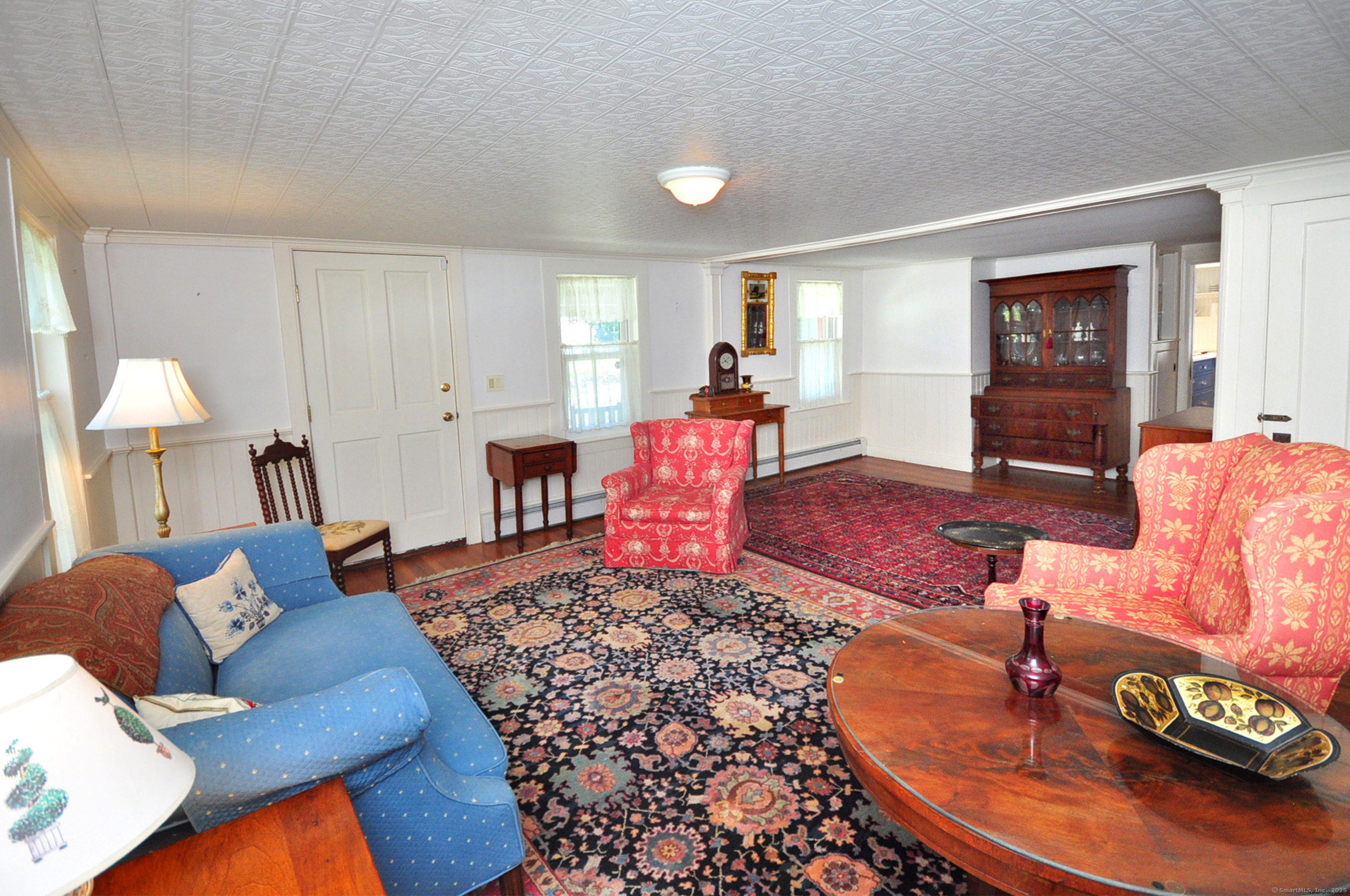 72 Clapboard Road Bridgewater, CT 06752 - Photo 35 of 39 a living room with furniture and a wooden floor
