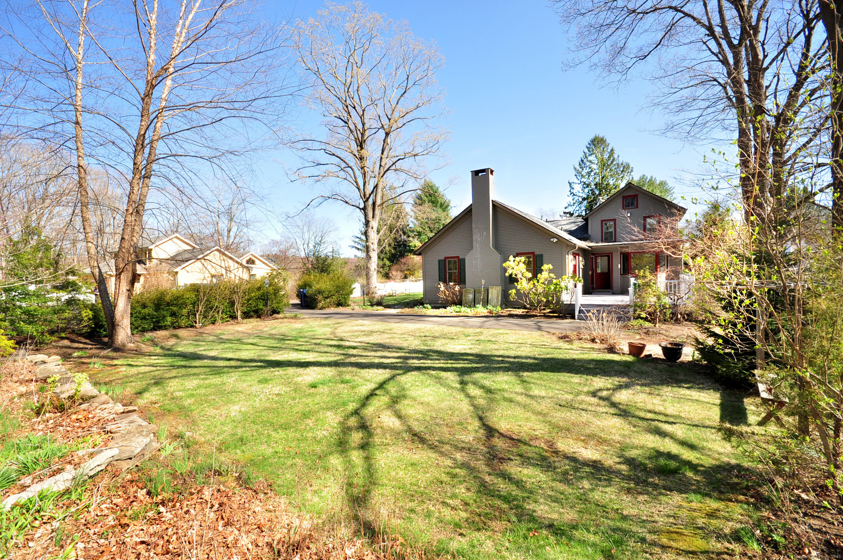 72 Clapboard Road Bridgewater, CT 06752 - Photo 38 of 39 a view of swimming pool with outdoor seating and house in the background