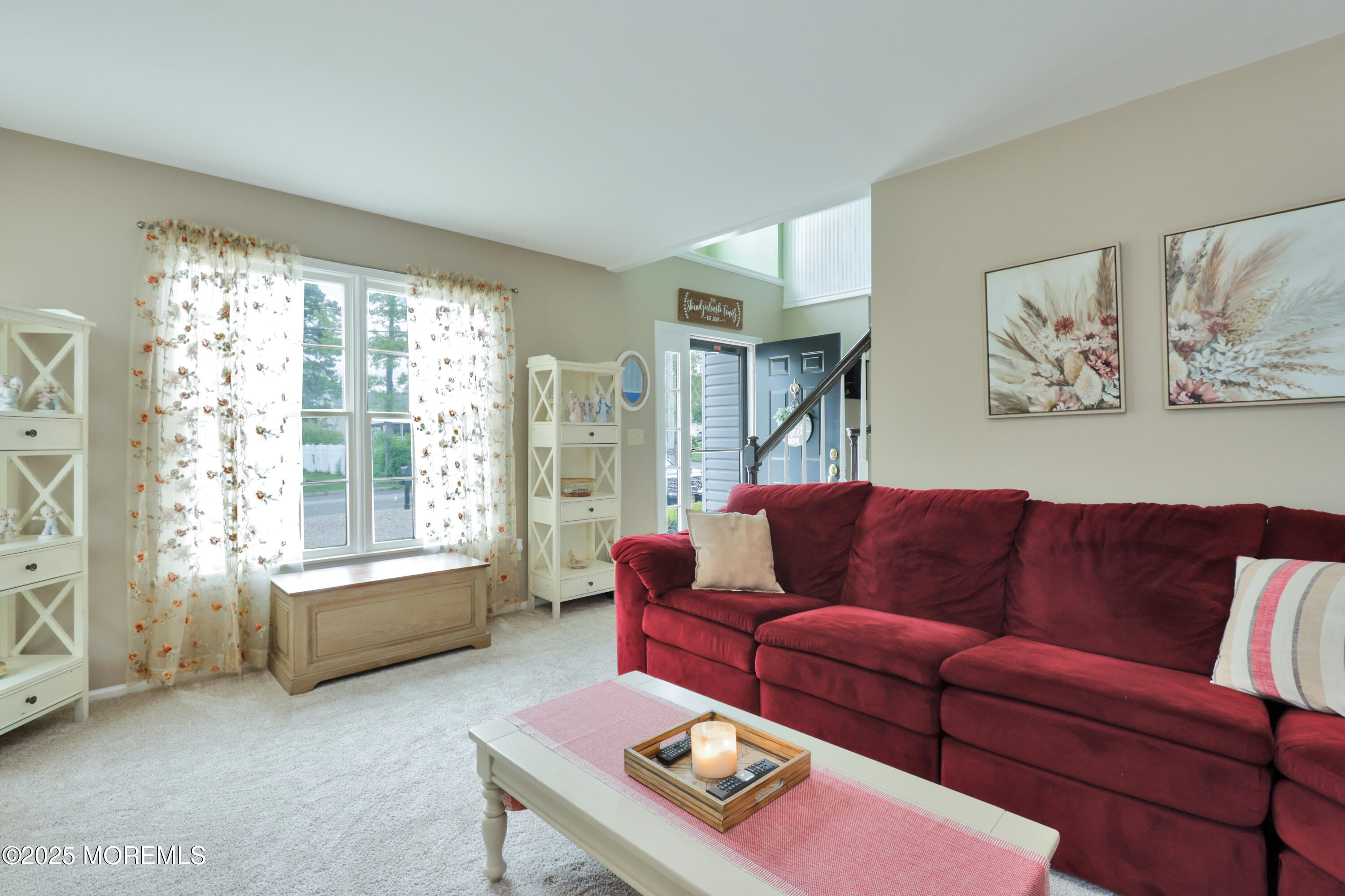 204 Stormy Road Manahawkin, NJ 08050 - Photo 11 of 44 a living room with furniture and a large window