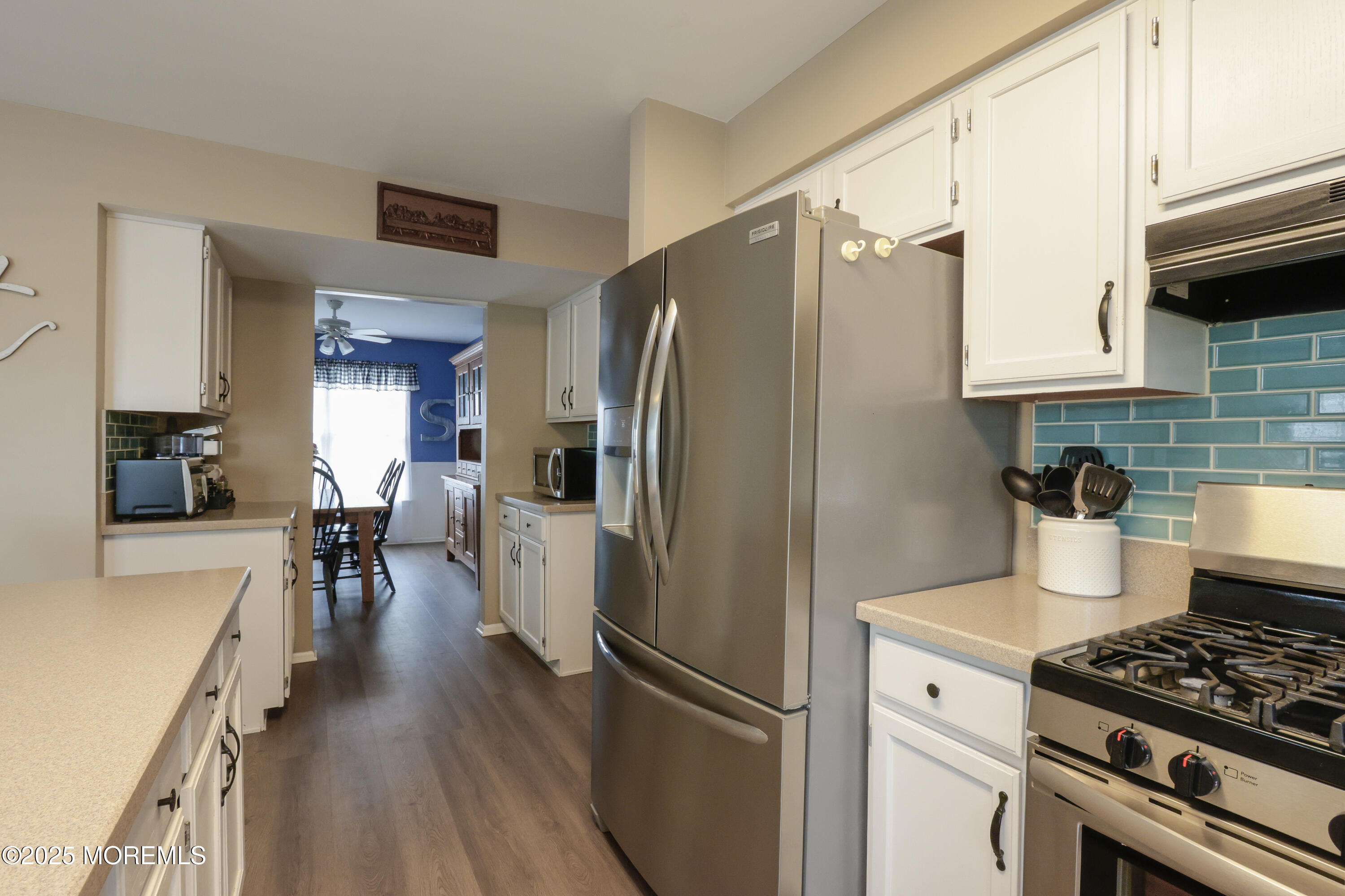 204 Stormy Road Manahawkin, NJ 08050 - Photo 17 of 44 a kitchen with granite countertop a refrigerator stove and sink