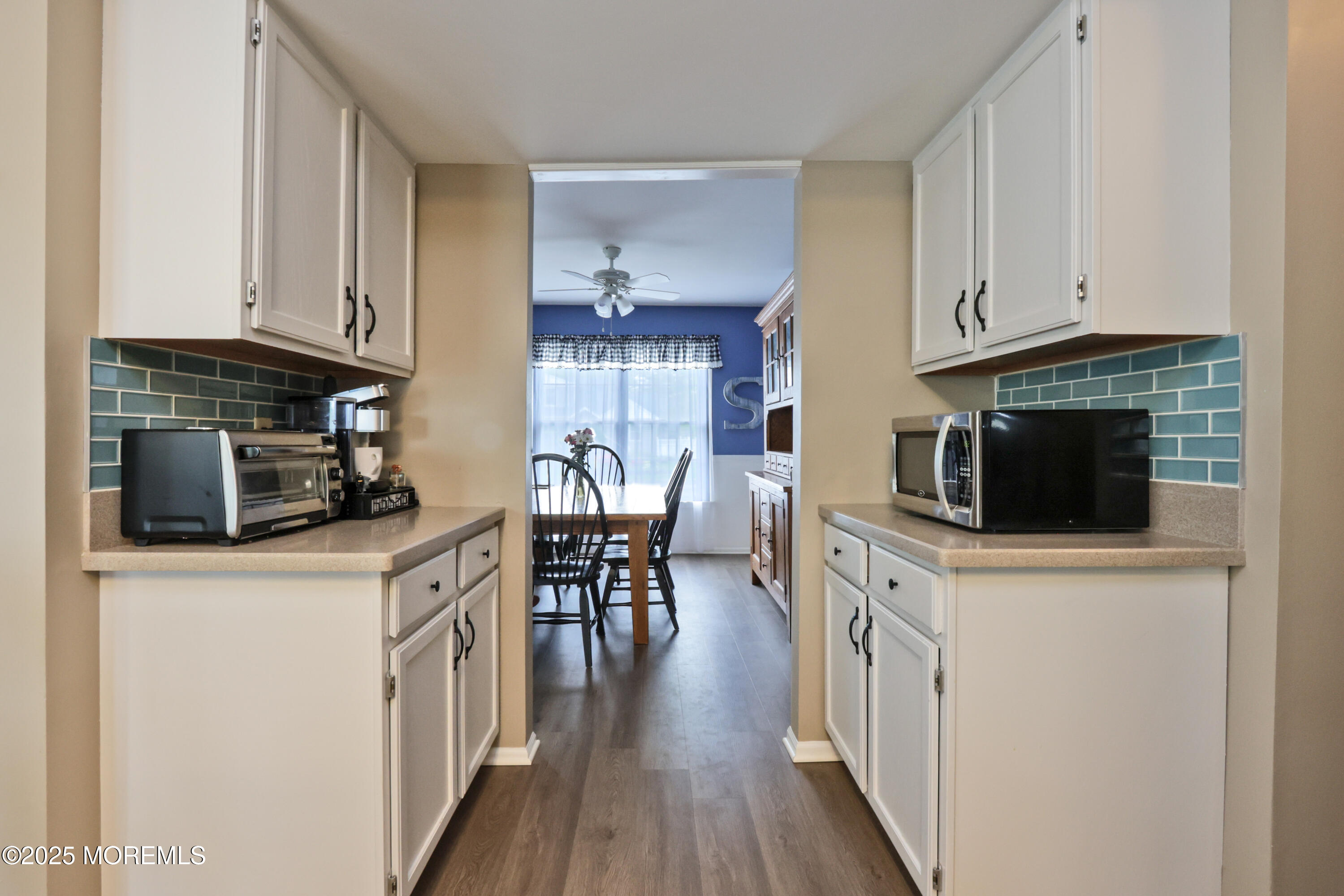 204 Stormy Road Manahawkin, NJ 08050 - Photo 21 of 44 a kitchen with stainless steel appliances a stove a sink a microwave and cabinets
