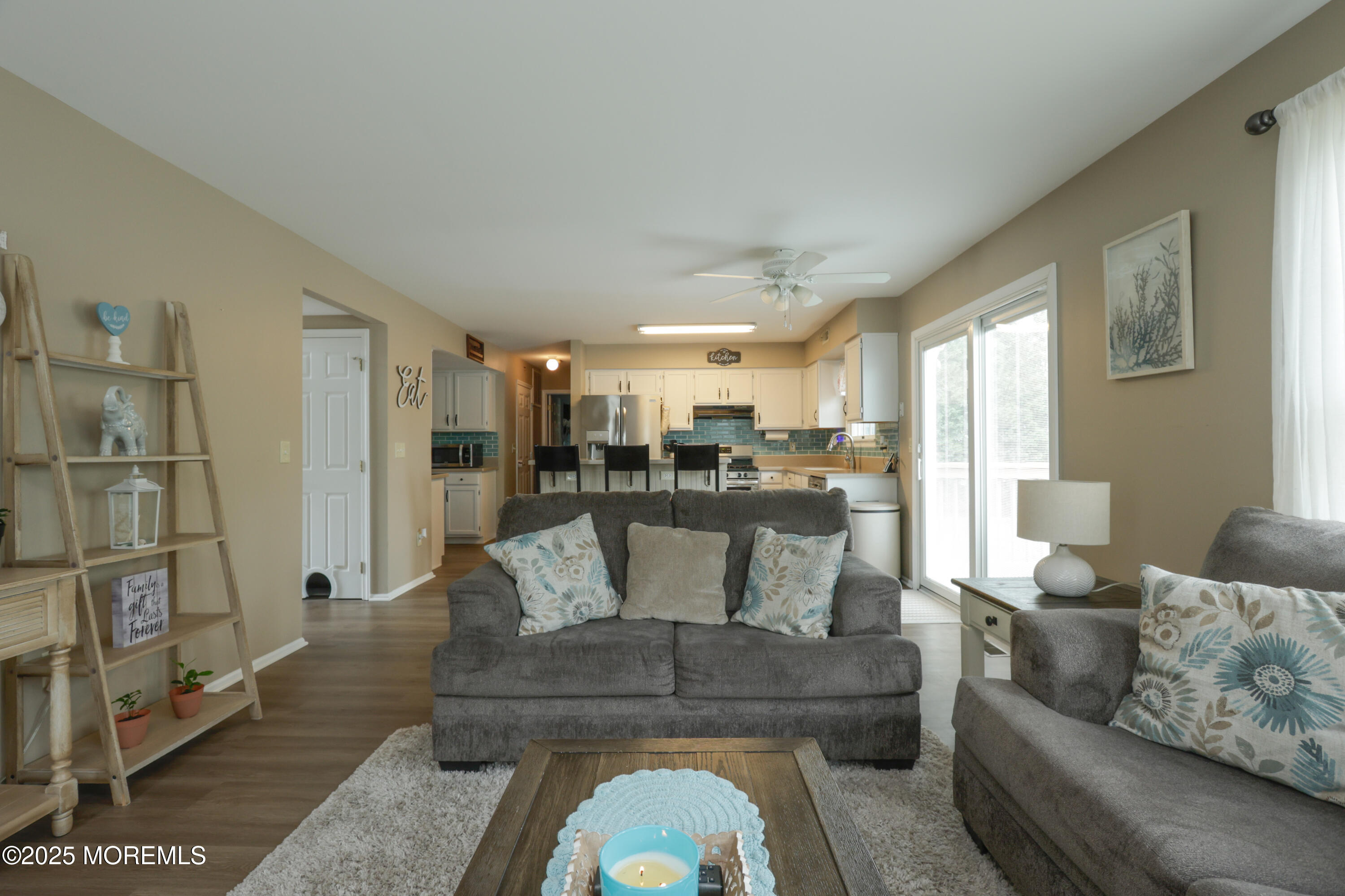 204 Stormy Road Manahawkin, NJ 08050 - Photo 22 of 44 a living room with furniture and a view of kitchen