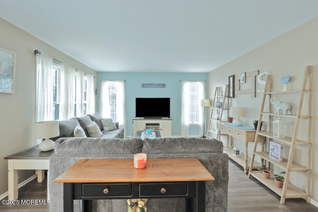 204 Stormy Road Manahawkin, NJ 08050 - Photo 24 of 44 a living room with furniture and a flat screen tv