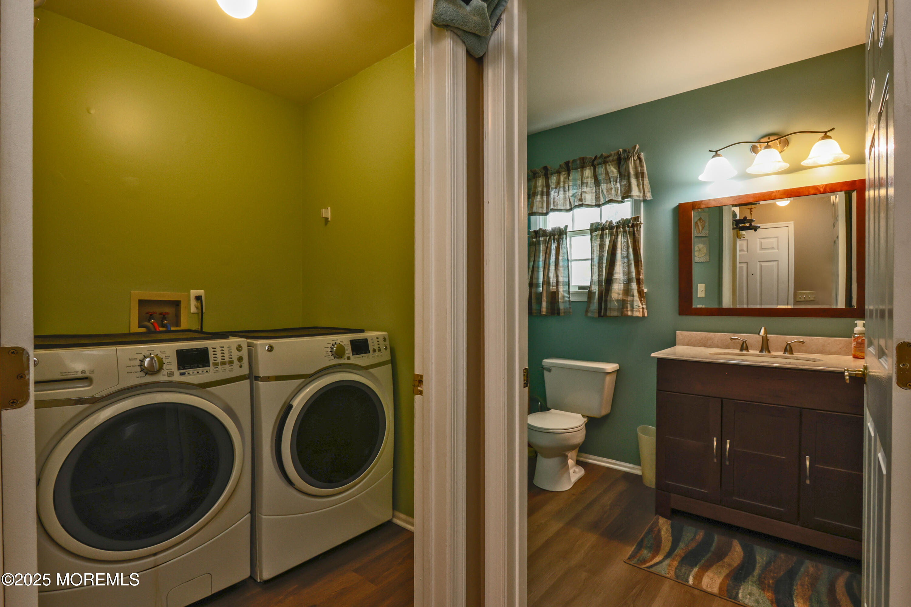 204 Stormy Road Manahawkin, NJ 08050 - Photo 27 of 44 a view of a bathroom with washing machine and sink