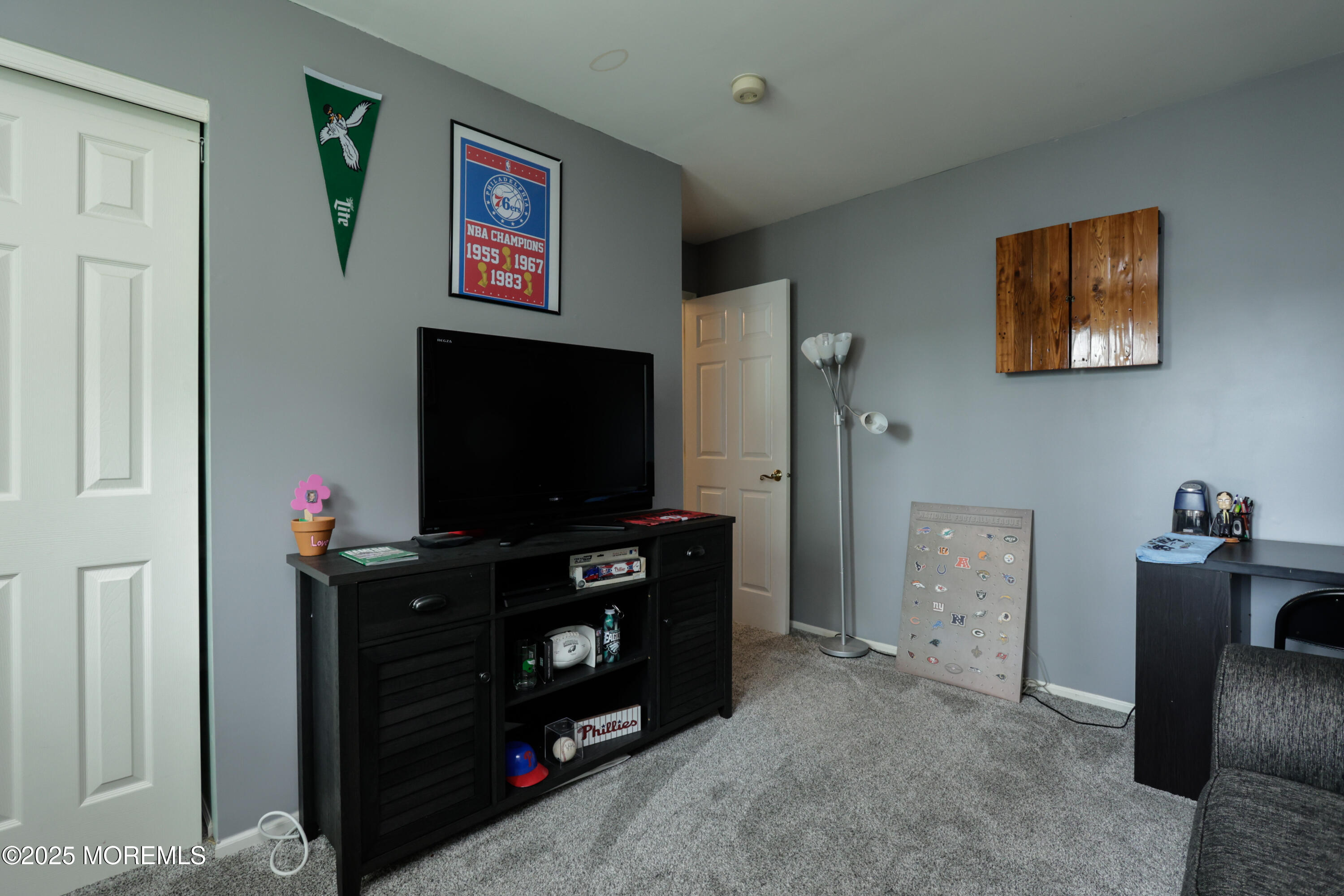 204 Stormy Road Manahawkin, NJ 08050 - Photo 28 of 44 a living room with furniture and a flat screen tv