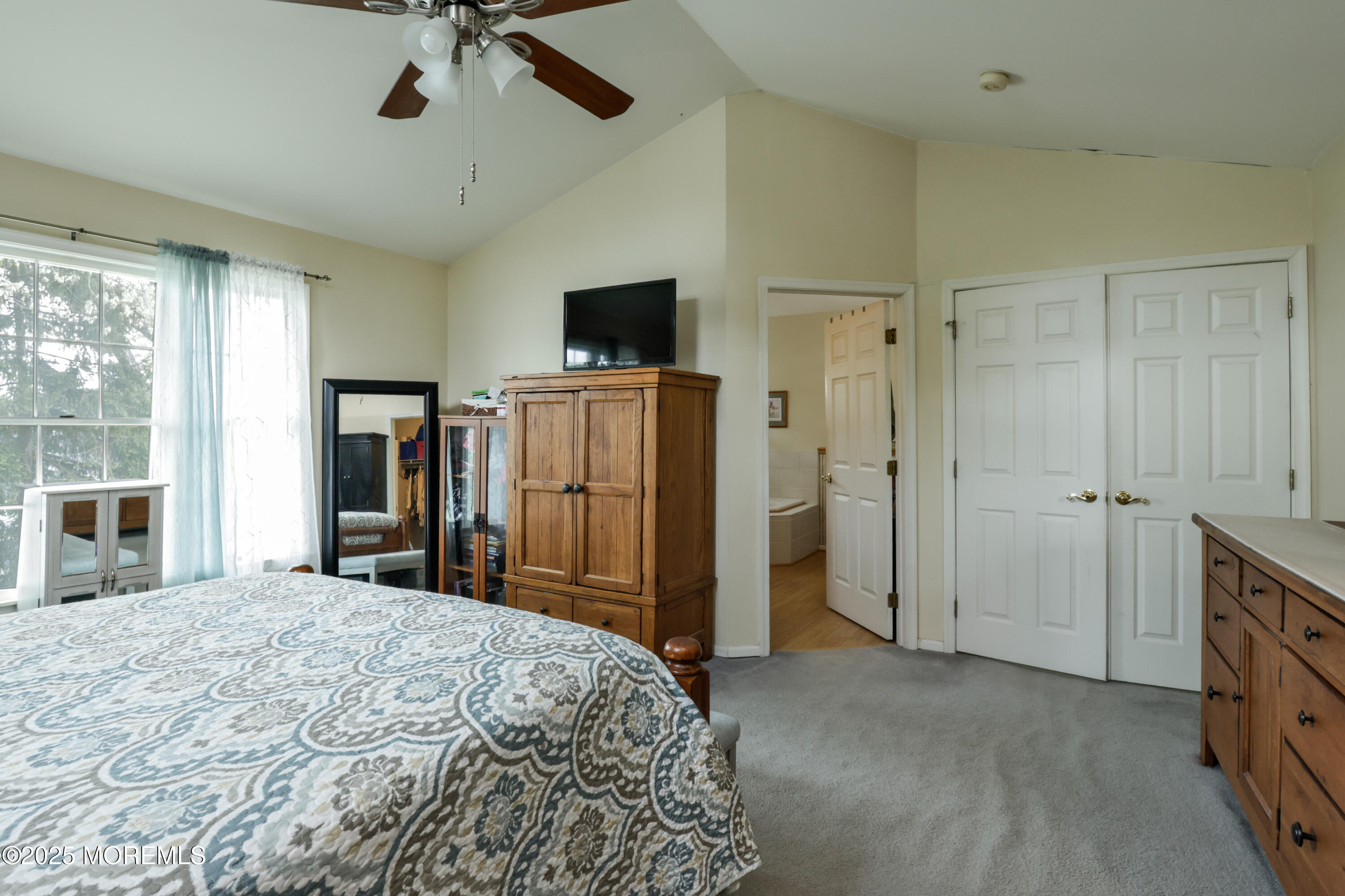204 Stormy Road Manahawkin, NJ 08050 - Photo 32 of 44 a bed room with a bed and a television