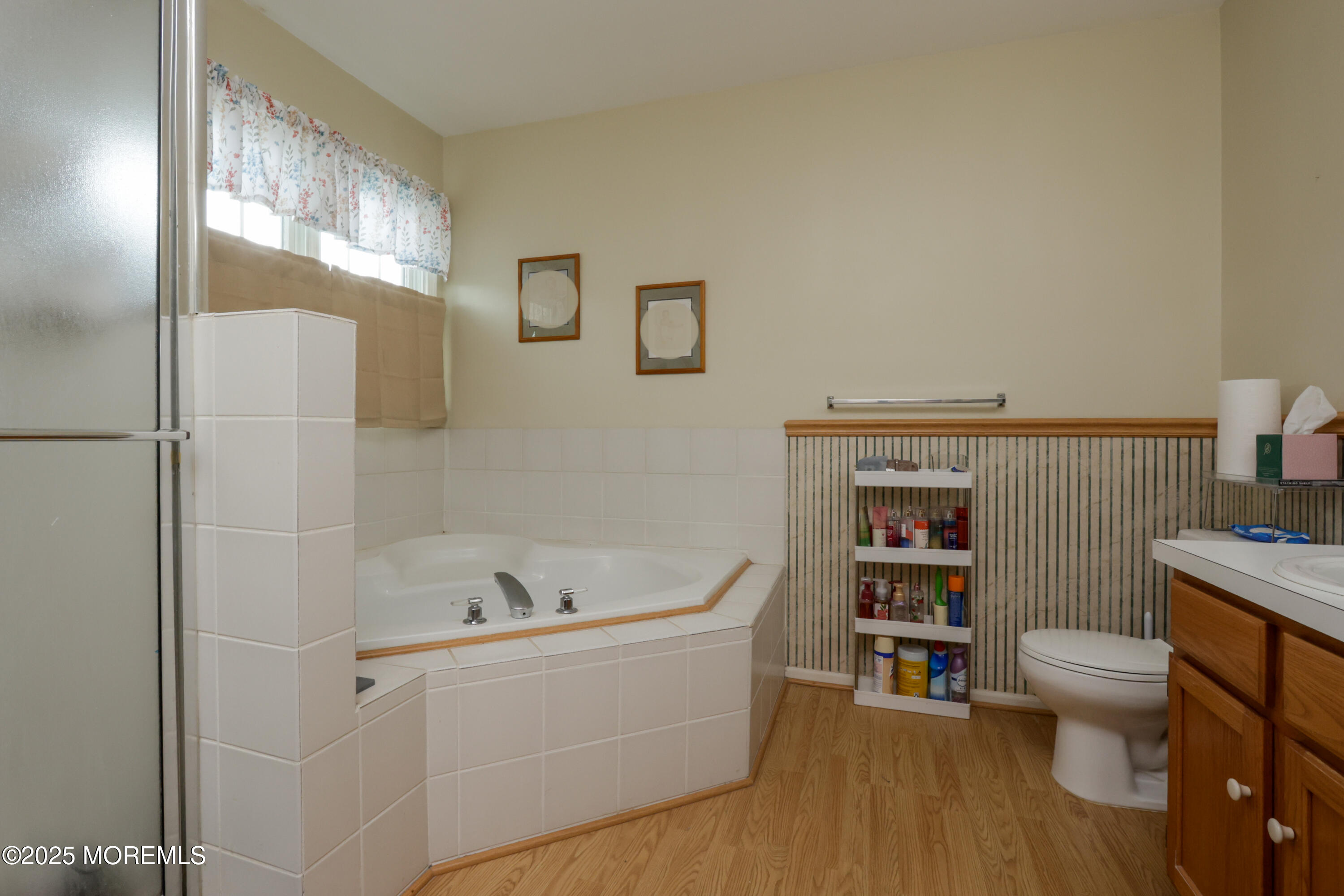 204 Stormy Road Manahawkin, NJ 08050 - Photo 35 of 44 a bathroom with a bathtub and a toilet