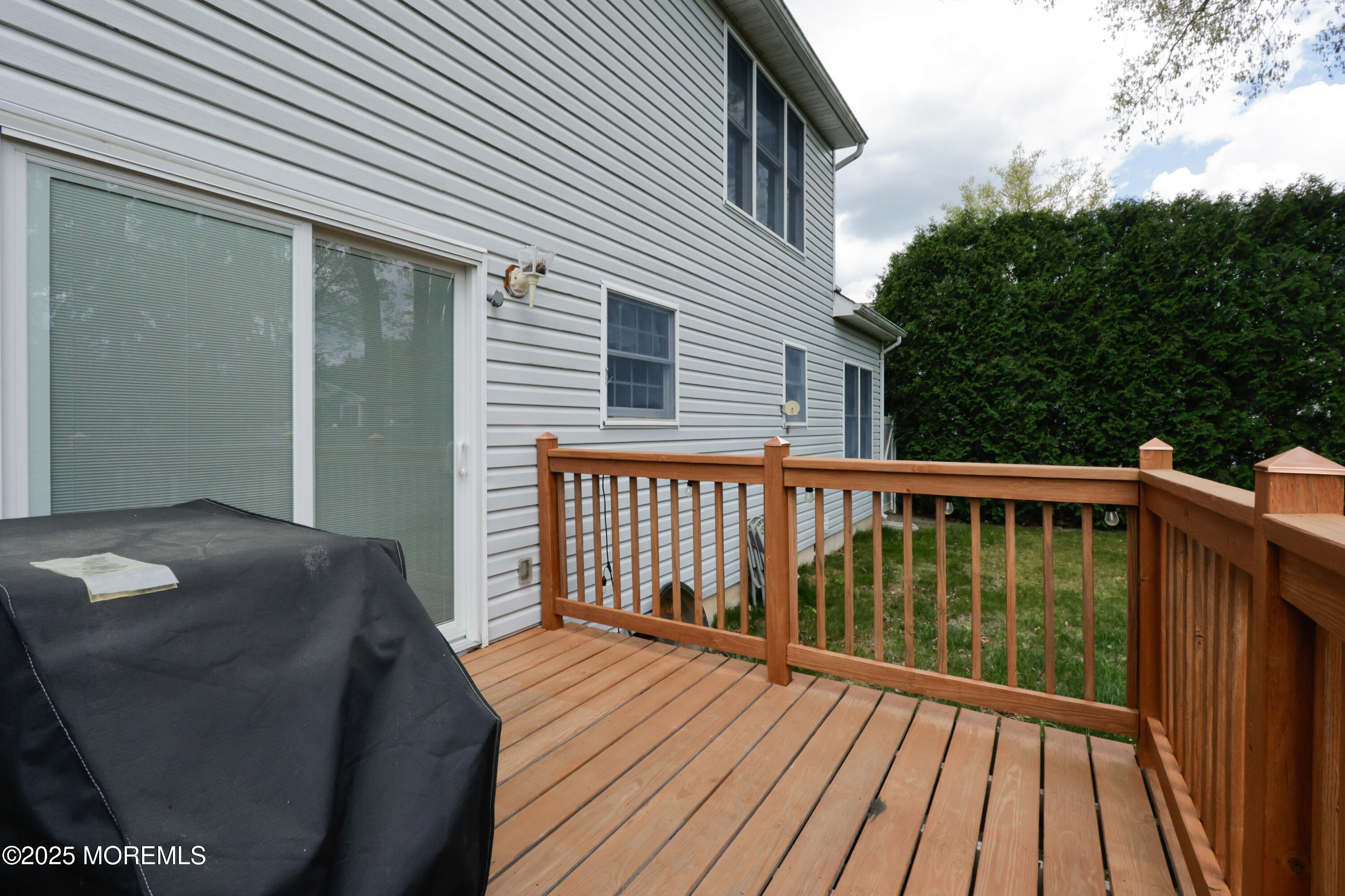 204 Stormy Road Manahawkin, NJ 08050 - Photo 40 of 44 a balcony with wooden floor