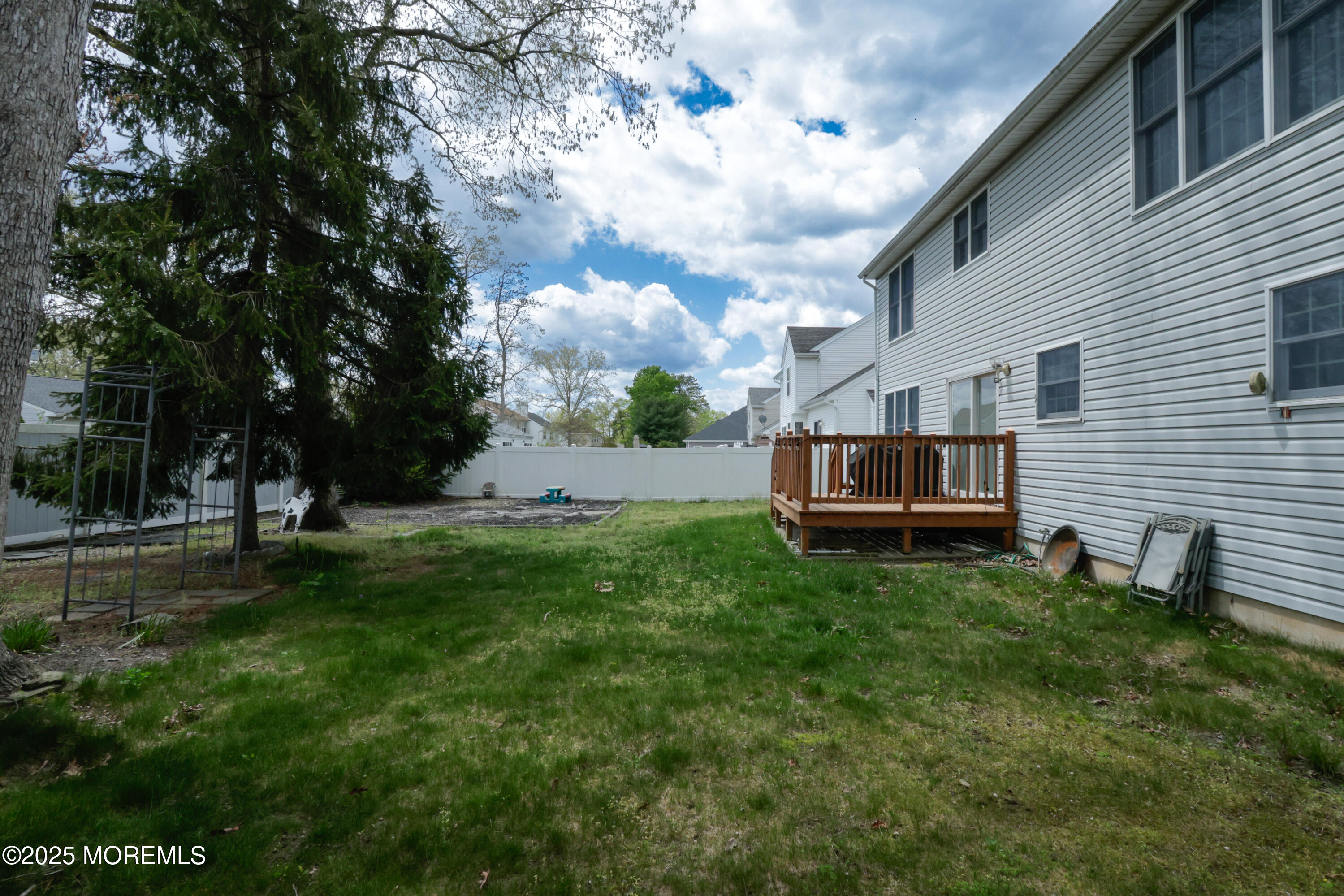 204 Stormy Road Manahawkin, NJ 08050 - Photo 41 of 44 a view of backyard with trampoline