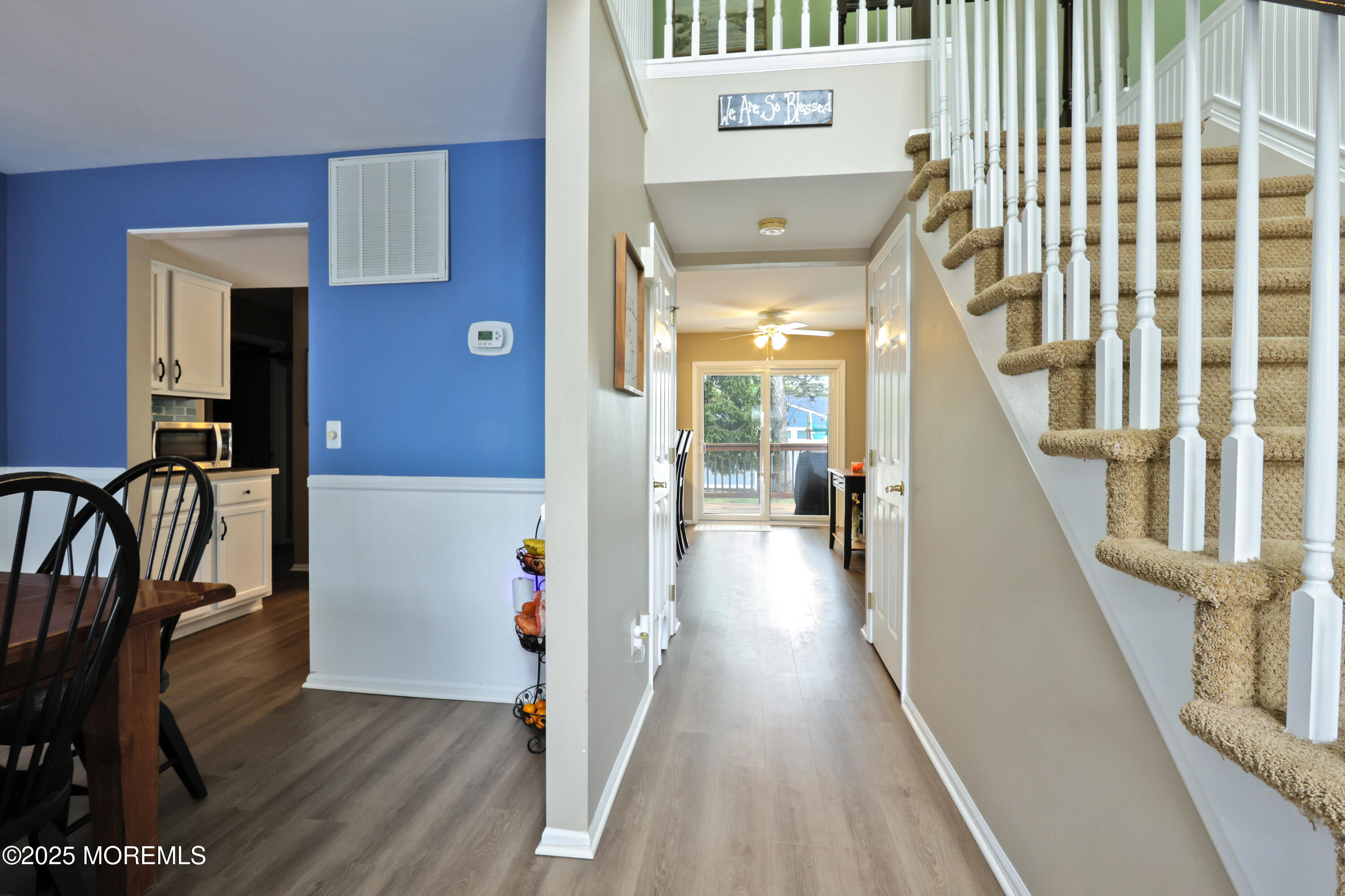 204 Stormy Road Manahawkin, NJ 08050 - Photo 6 of 44 a view of a hallway with furniture and wooden floor