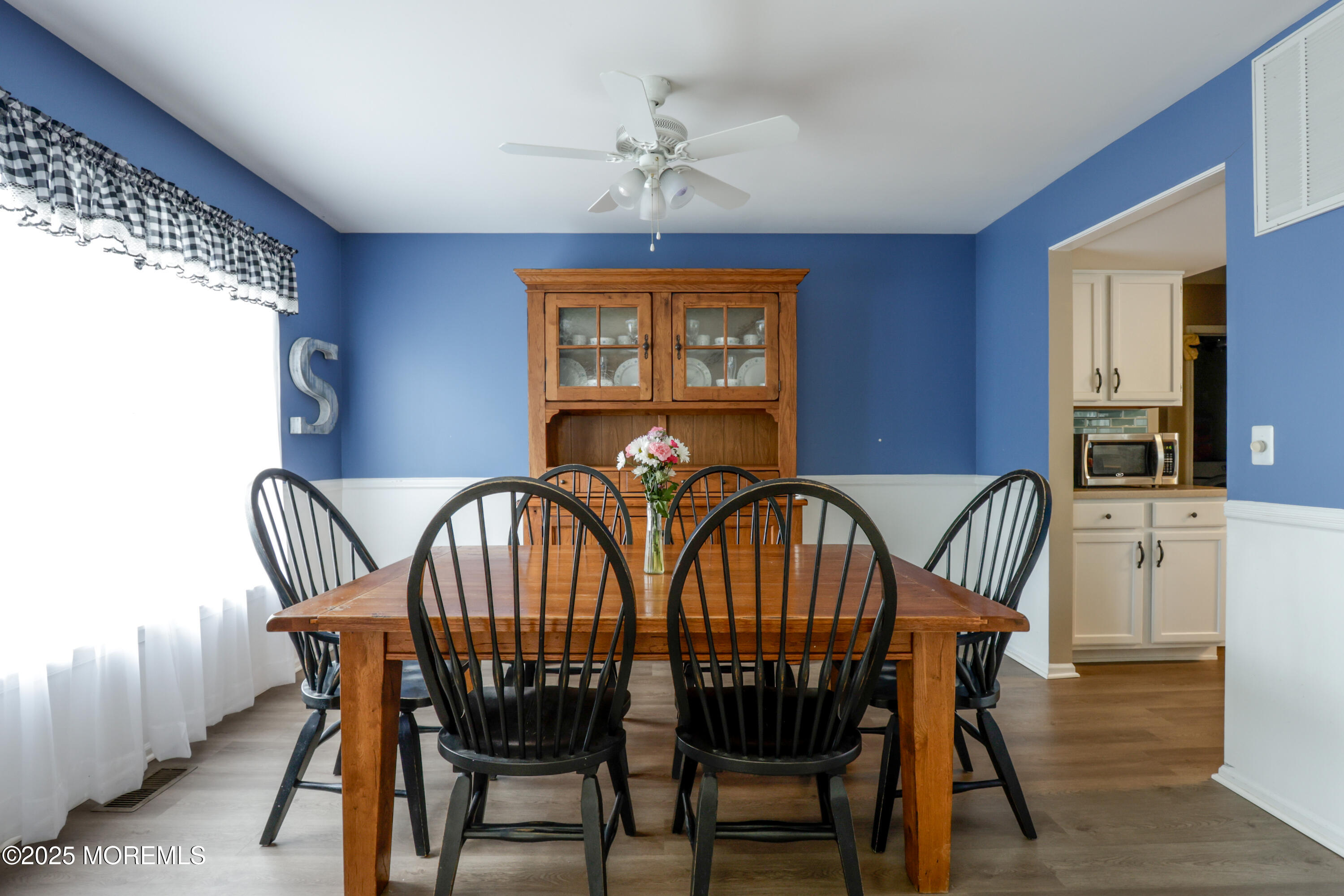 204 Stormy Road Manahawkin, NJ 08050 - Photo 8 of 44 a view of a dining room with furniture window and wooden floor