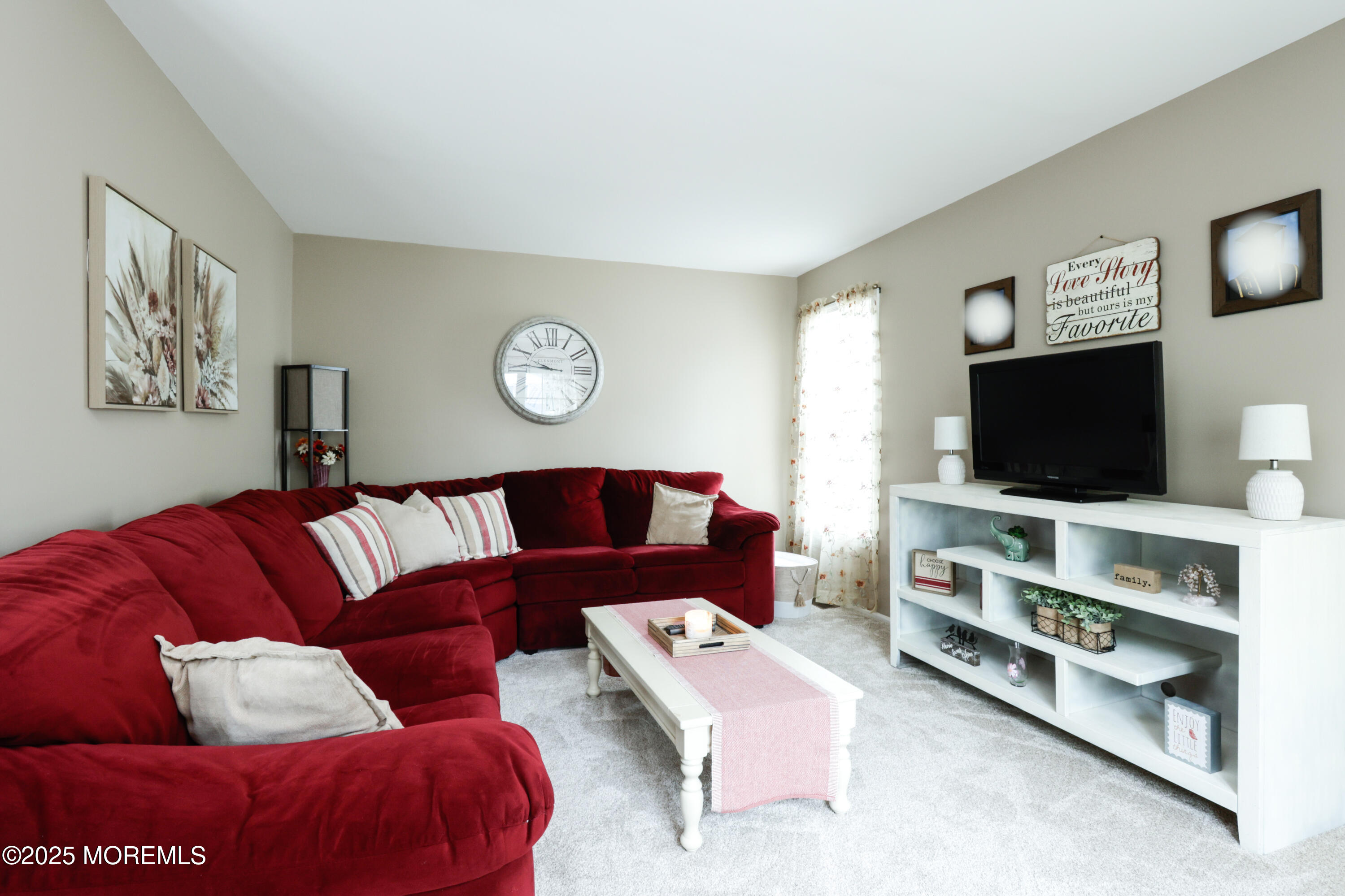 204 Stormy Road Manahawkin, NJ 08050 - Photo 10 of 44 a living room with furniture and a flat screen tv