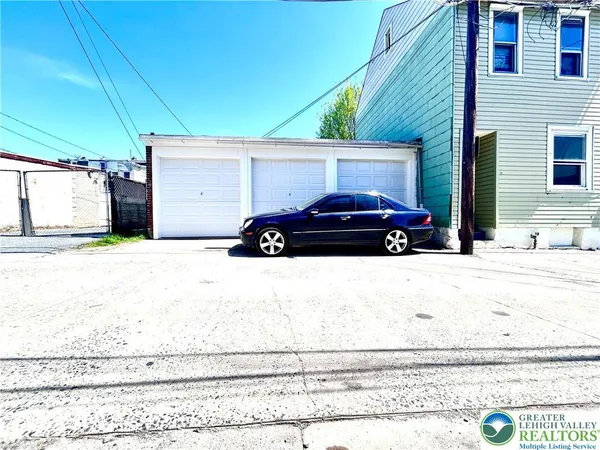 a car parked in front of a house