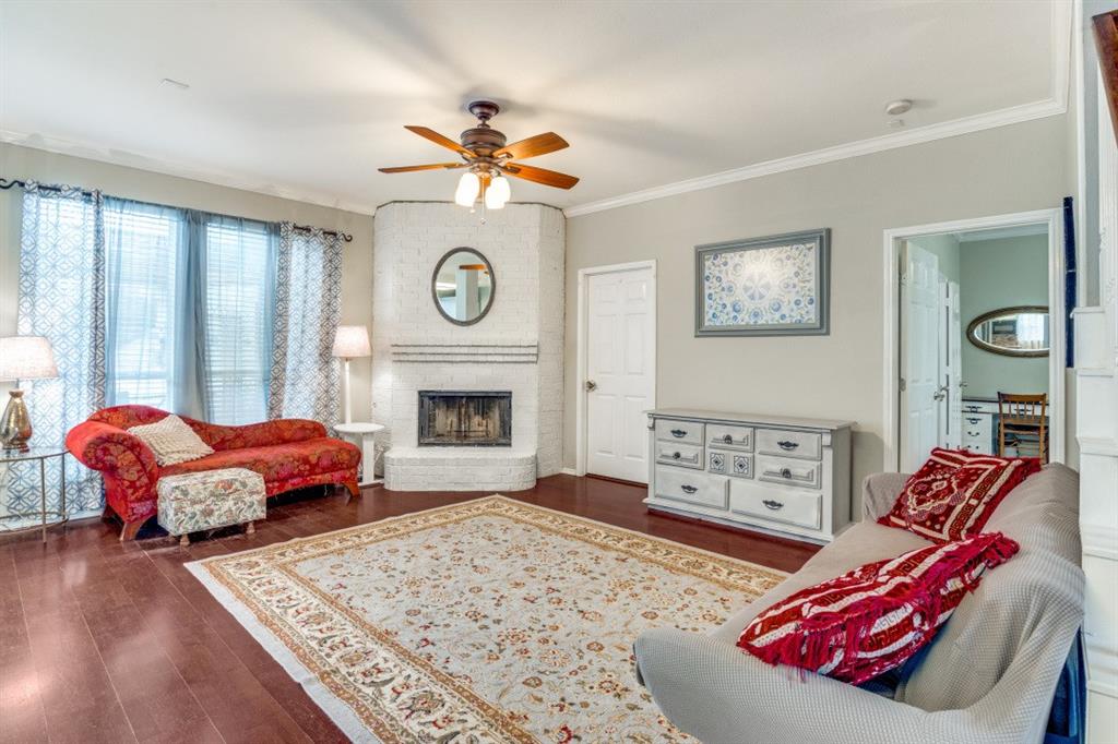 2031 Knights Court Allen, TX 75013 - Photo 2 of 12 a living room with furniture a rug and a fireplace