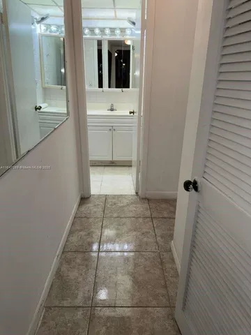 a bathroom with a sink and mirror