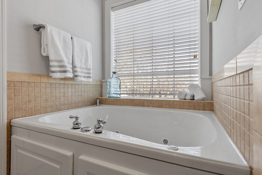88 Ferry Road Salisbury, MA 01952 - Photo 21 of 42 a bathroom with a bathtub and a window