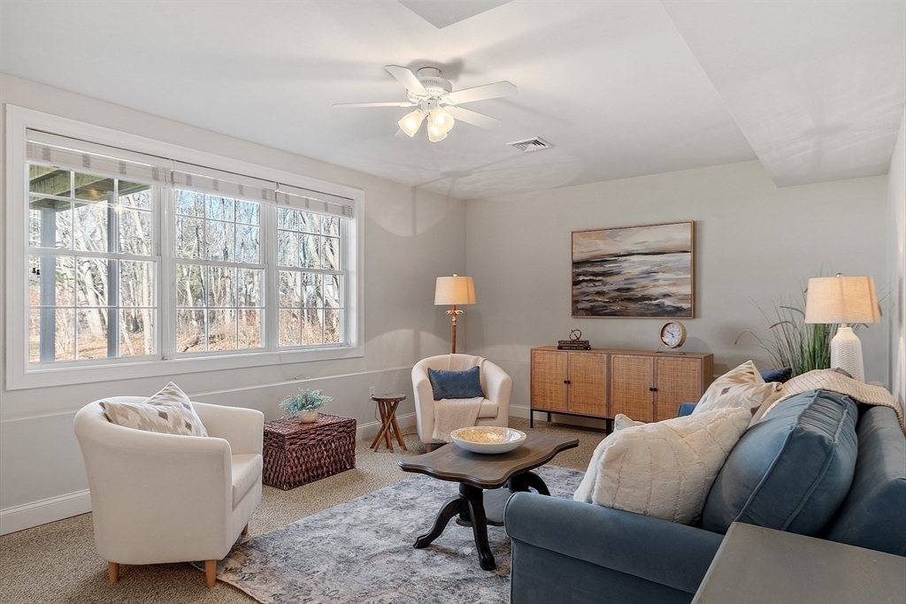 88 Ferry Road Salisbury, MA 01952 - Photo 36 of 42 a living room with furniture and a chandelier