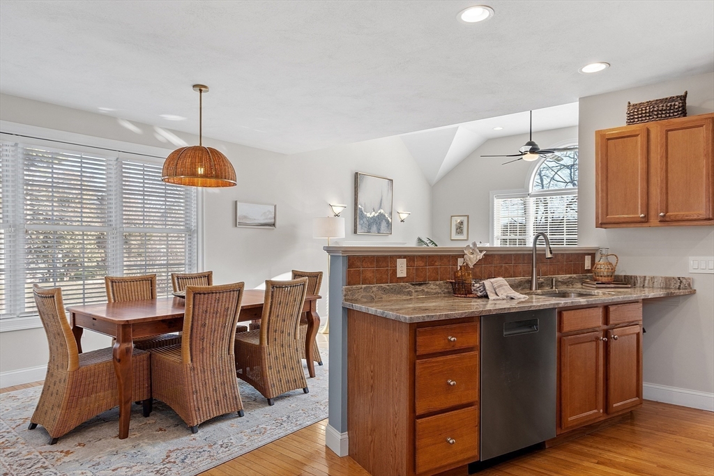 88 Ferry Road Salisbury, MA 01952 - Photo 9 of 42 a kitchen with stainless steel appliances granite countertop a sink a stove and a wooden floors