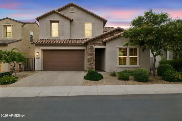 a front view of a house with garage and garage