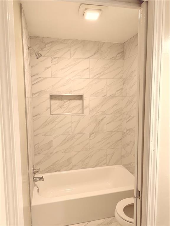 4707 Riverwood Circle Decatur, GA 30035 - Photo 14 of 17 a bathroom with a bathtub and a shower