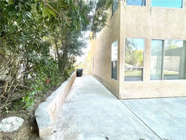 a view of a wooden floor in front of a house