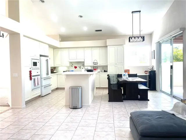 a living room with kitchen island furniture and a window