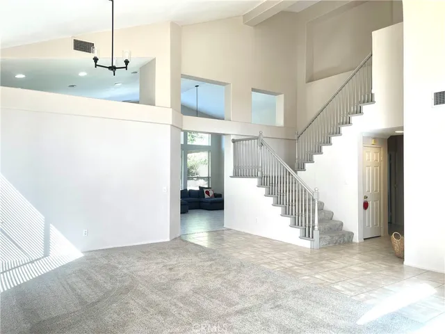 a view of a hallway with staircase