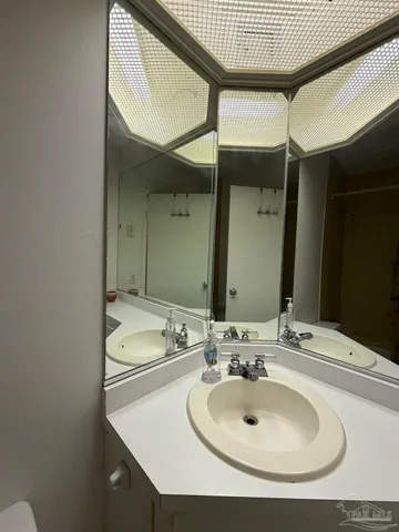 a bathroom with a sink and a mirror