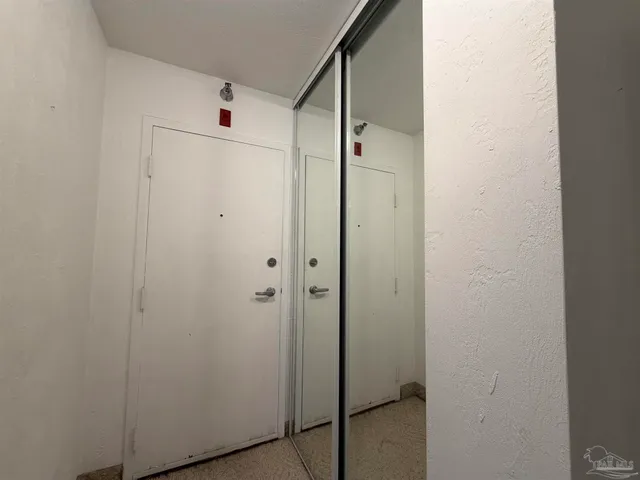 a bathroom with a shower and a glass door