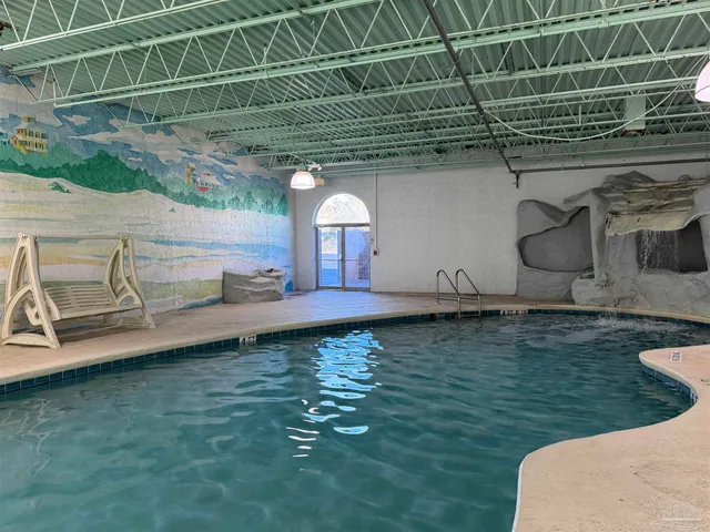 a view of a backyard with table and chairs a barbeque