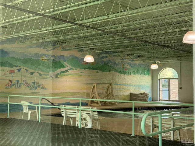 a view of a chairs and table in a balcony