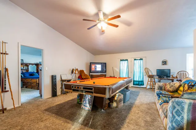 a room with furniture and air hockey table