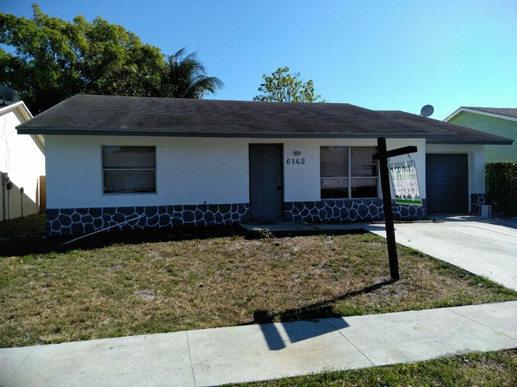 6142 Westfall Road Lake Worth, FL 33463 - Photo 1 of 18 Front