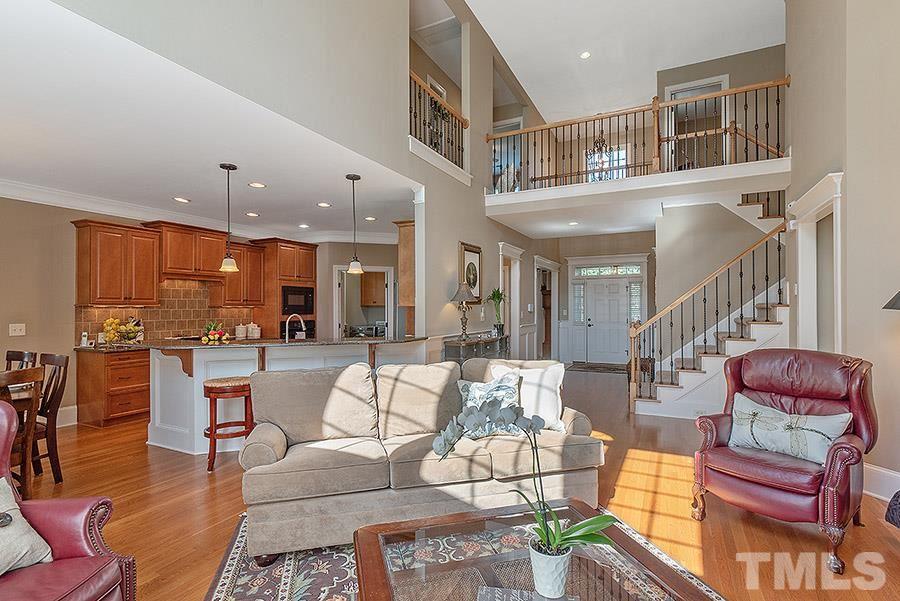 117 Bancroft Brook Drive Cary, NC 27519 - Photo 13 of 29 a living room with furniture or stairs and a wooden floor