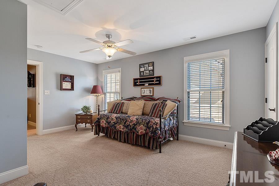 117 Bancroft Brook Drive Cary, NC 27519 - Photo 21 of 29 a bed room with a bed and a couch