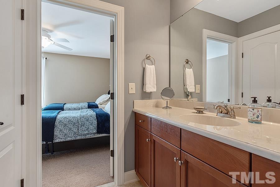 117 Bancroft Brook Drive Cary, NC 27519 - Photo 24 of 29 a en suite bathroom with a double vanity sink and mirror