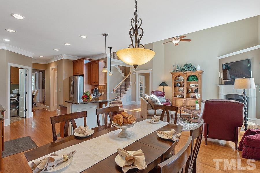 117 Bancroft Brook Drive Cary, NC 27519 - Photo 10 of 29 a living room with furniture a large window and a table