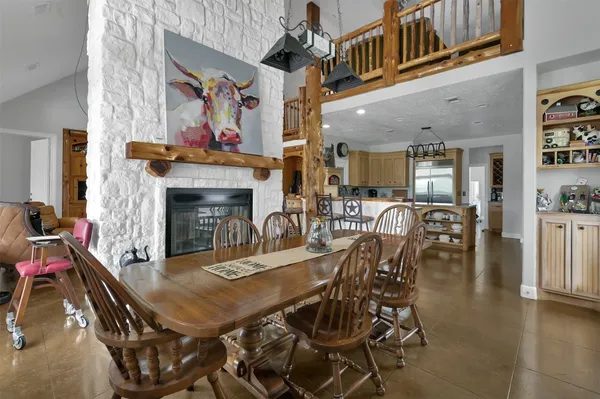 a dining room with furniture and wooden floor