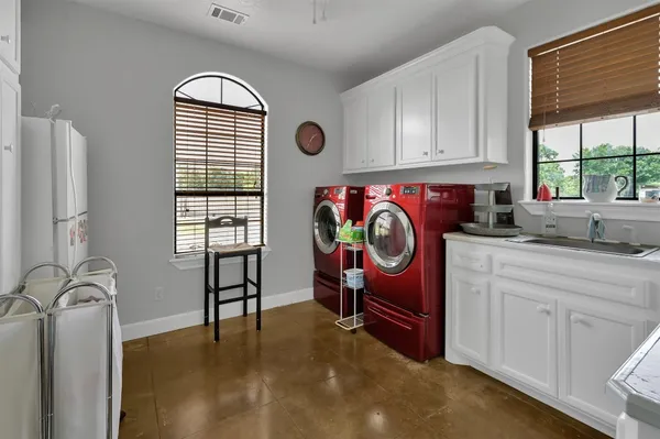 a kitchen with stainless steel appliances granite countertop a stove and a sink