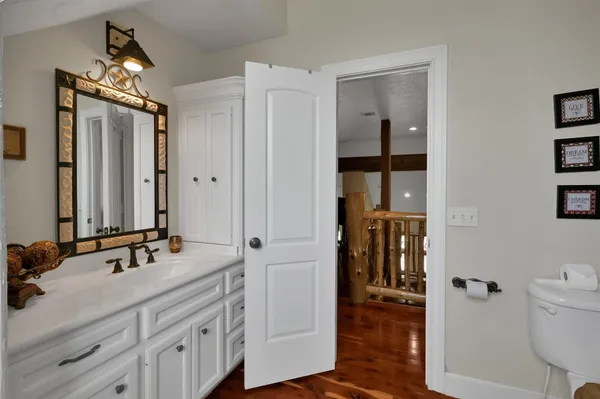 a bathroom with a double vanity sink and mirror