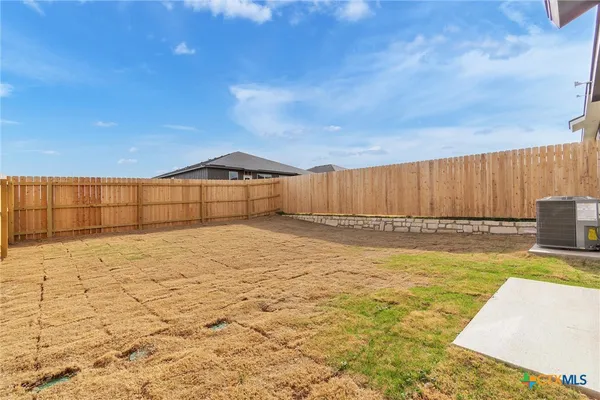 a view of a swimming pool with a yard
