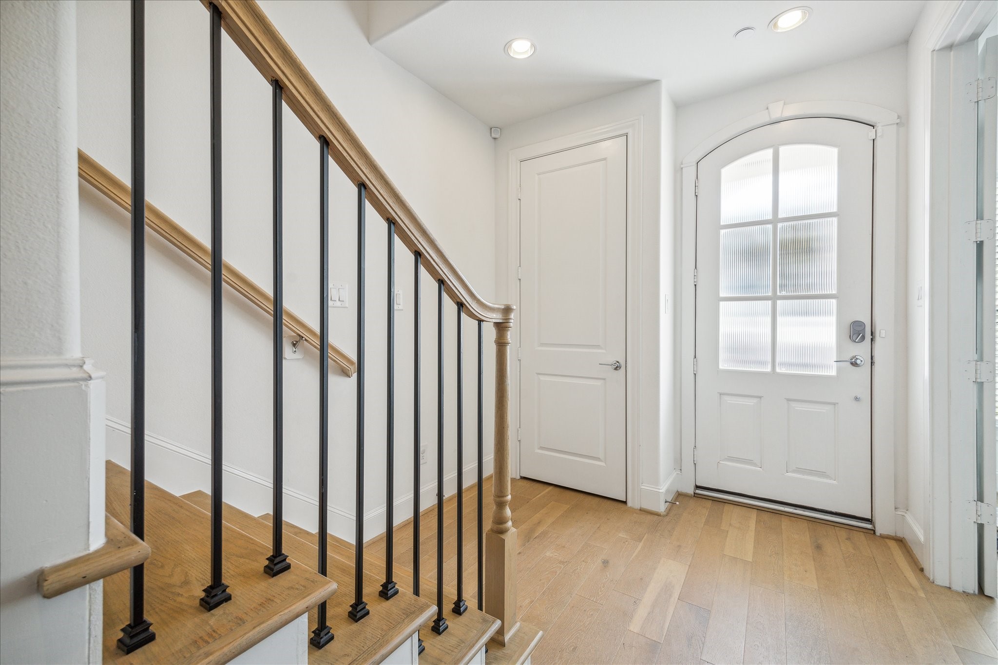 2714 Harvard Street Houston, TX 77008 - Photo 10 of 32 a view of an entryway with wooden floor and door
