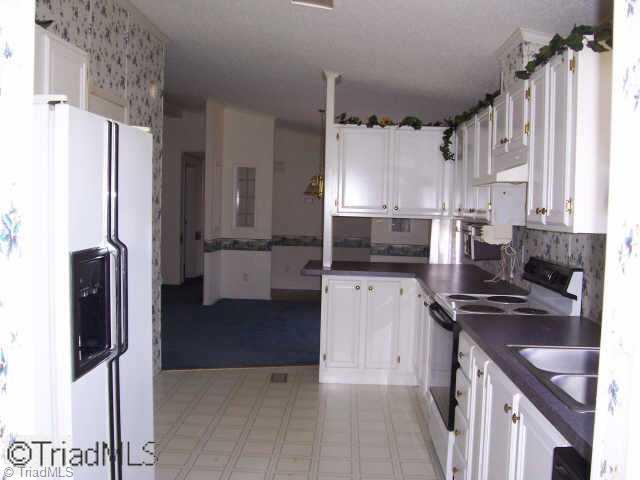4104 Dodgetown Road Walnut Cove, NC 27052 - Photo 3 of 8 Other. Range, refrigerator, and dishwasher to remain with home.