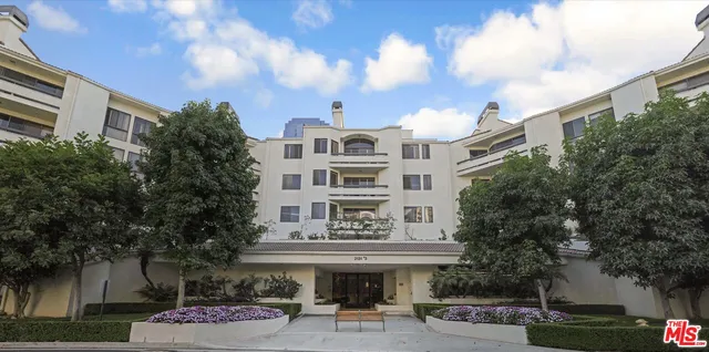 a front view of a building with garden