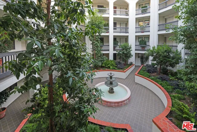 a house with swimming pool and garden view