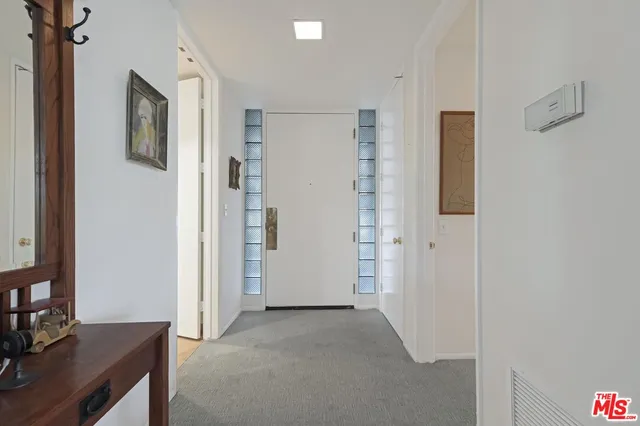 a view of a livingroom with a workspace